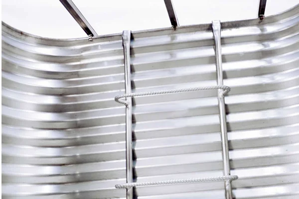 Steel window well ladder installed in a galvanized egress well